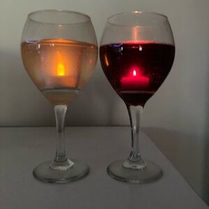 Two Partylite gel wine glass candle holders.